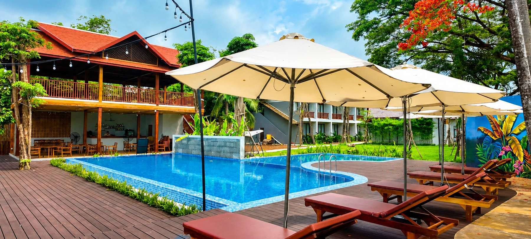 The pool deck and the two-storey timber restaurant building
